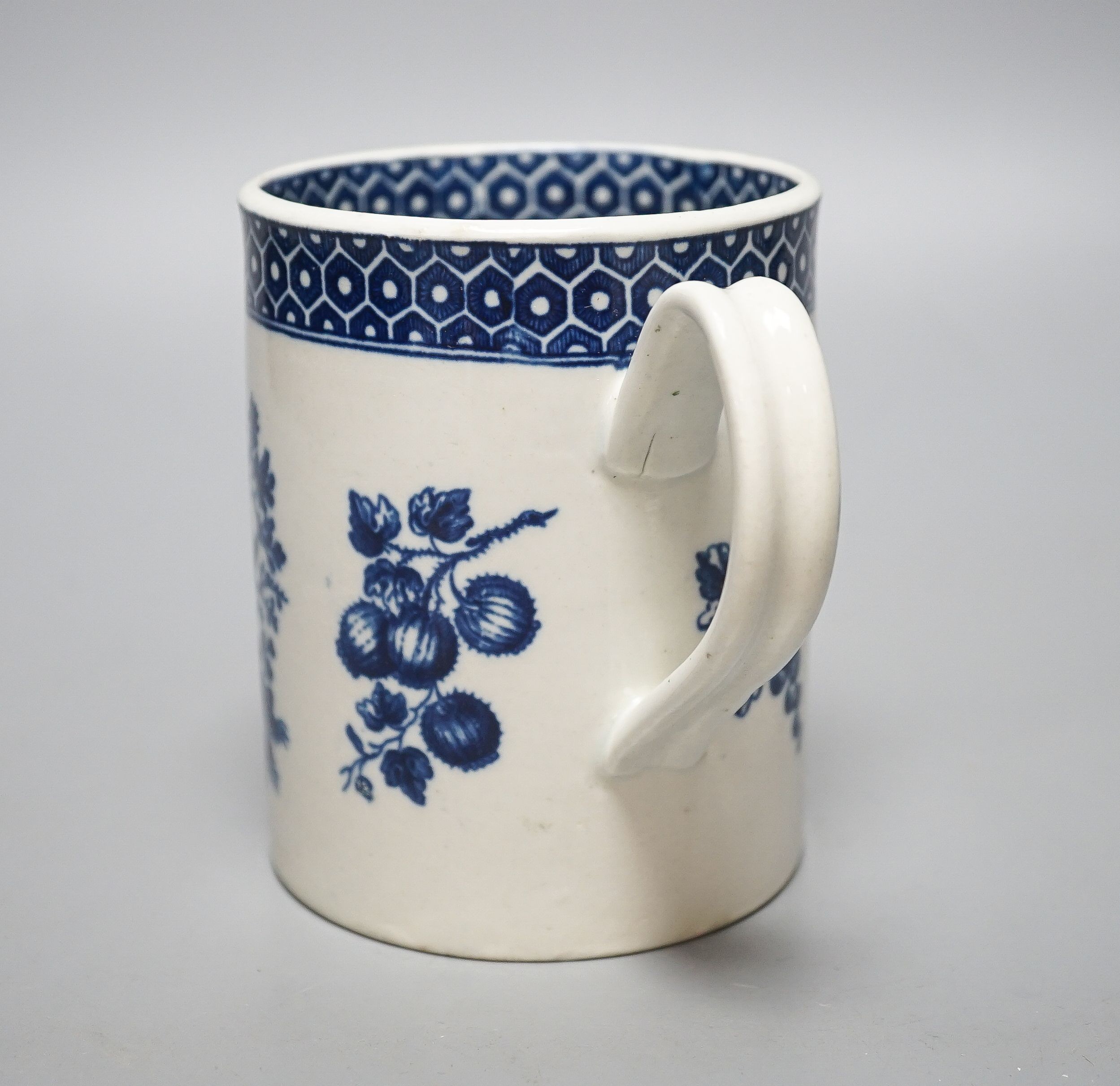 A Worcester cylindrical mug, parrot pecking fruit pattern c.1770, 11.5cm high